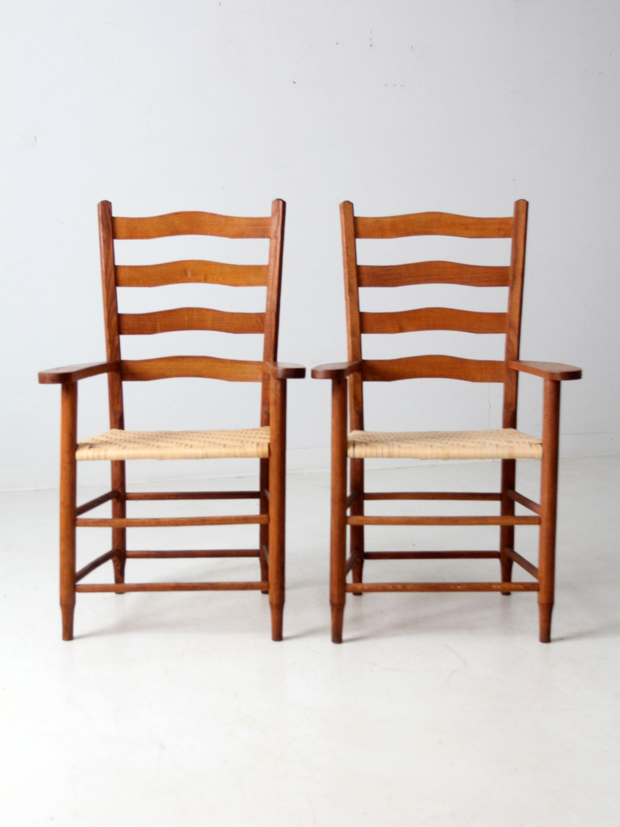 pair antique ladder back arm chairs