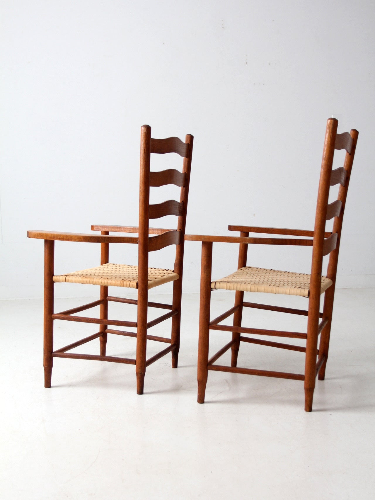 pair antique ladder back arm chairs