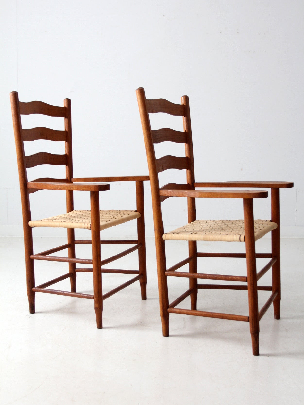 pair antique ladder back arm chairs
