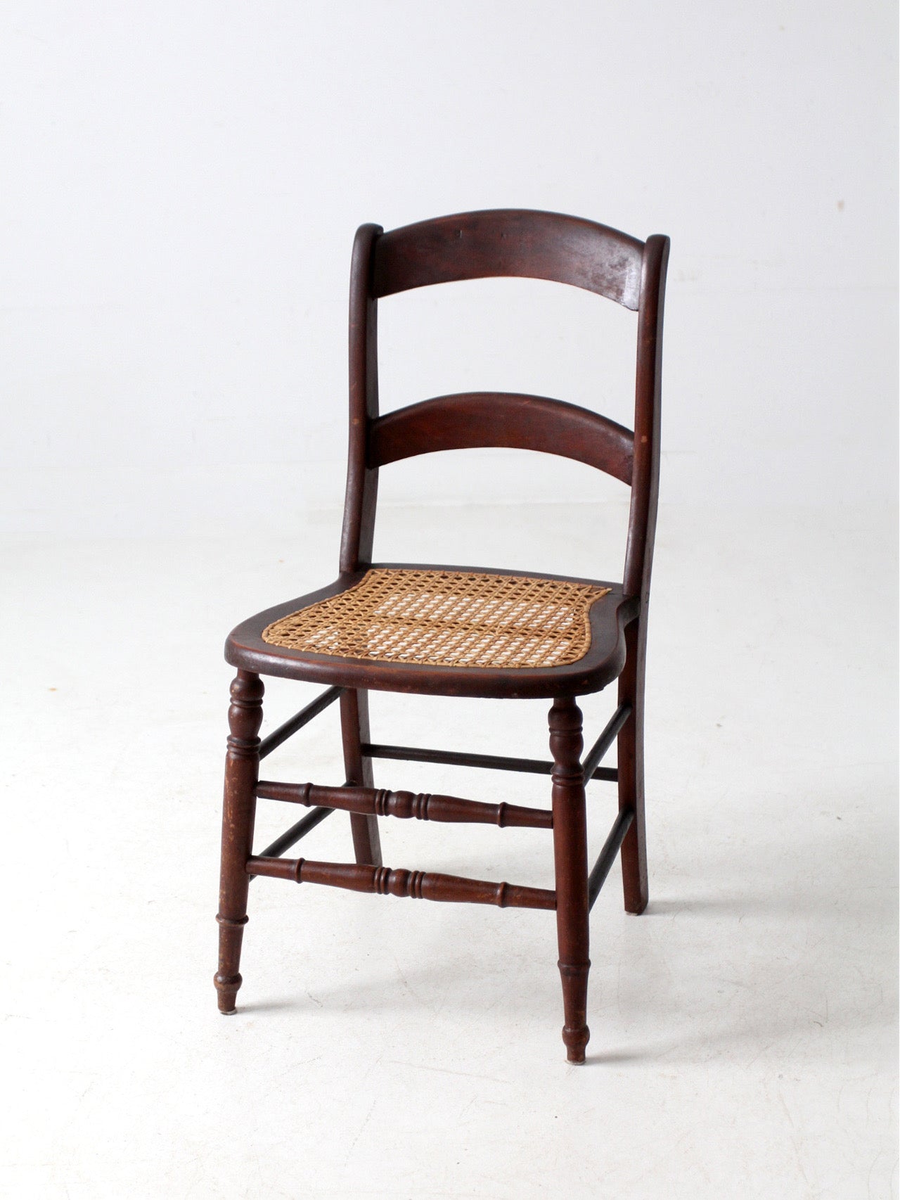 antique American cane seat ladder back chair