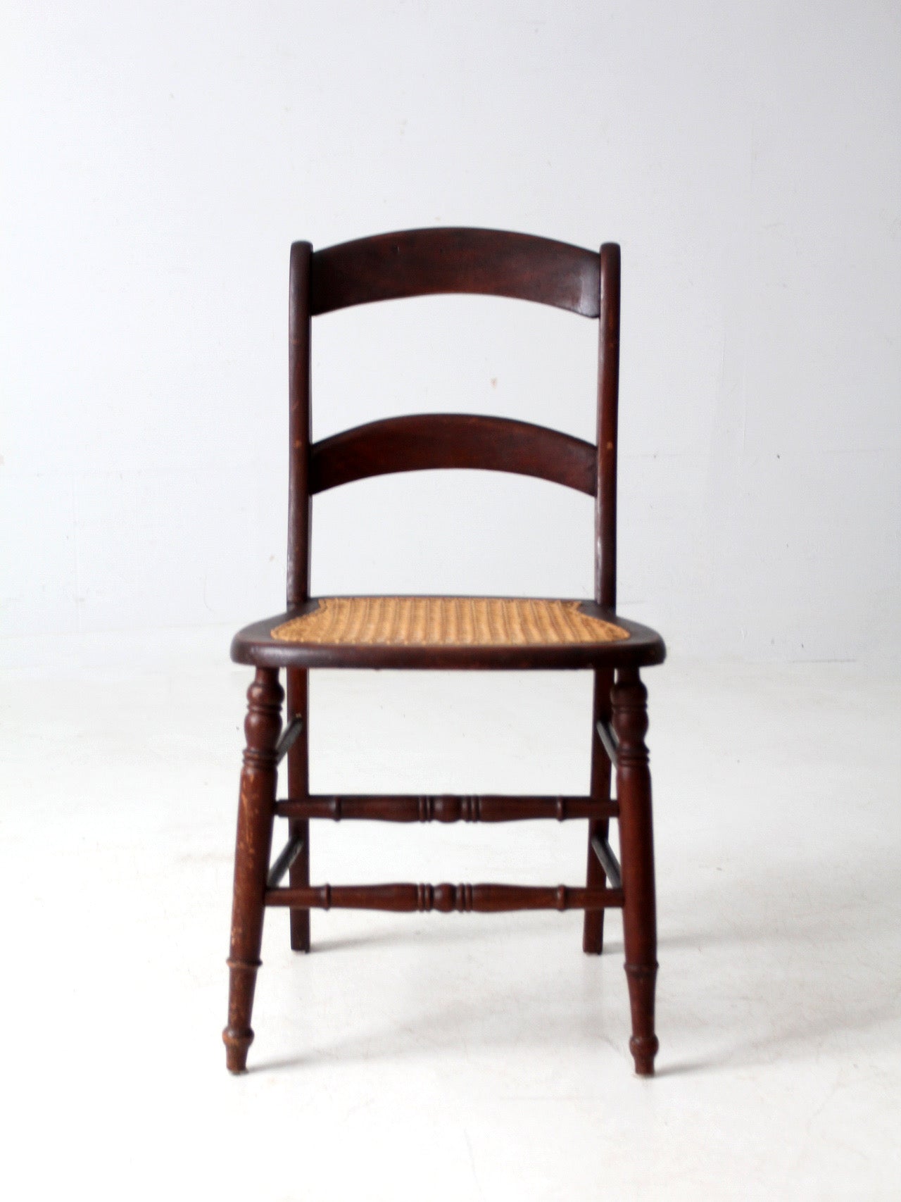 antique American cane seat ladder back chair
