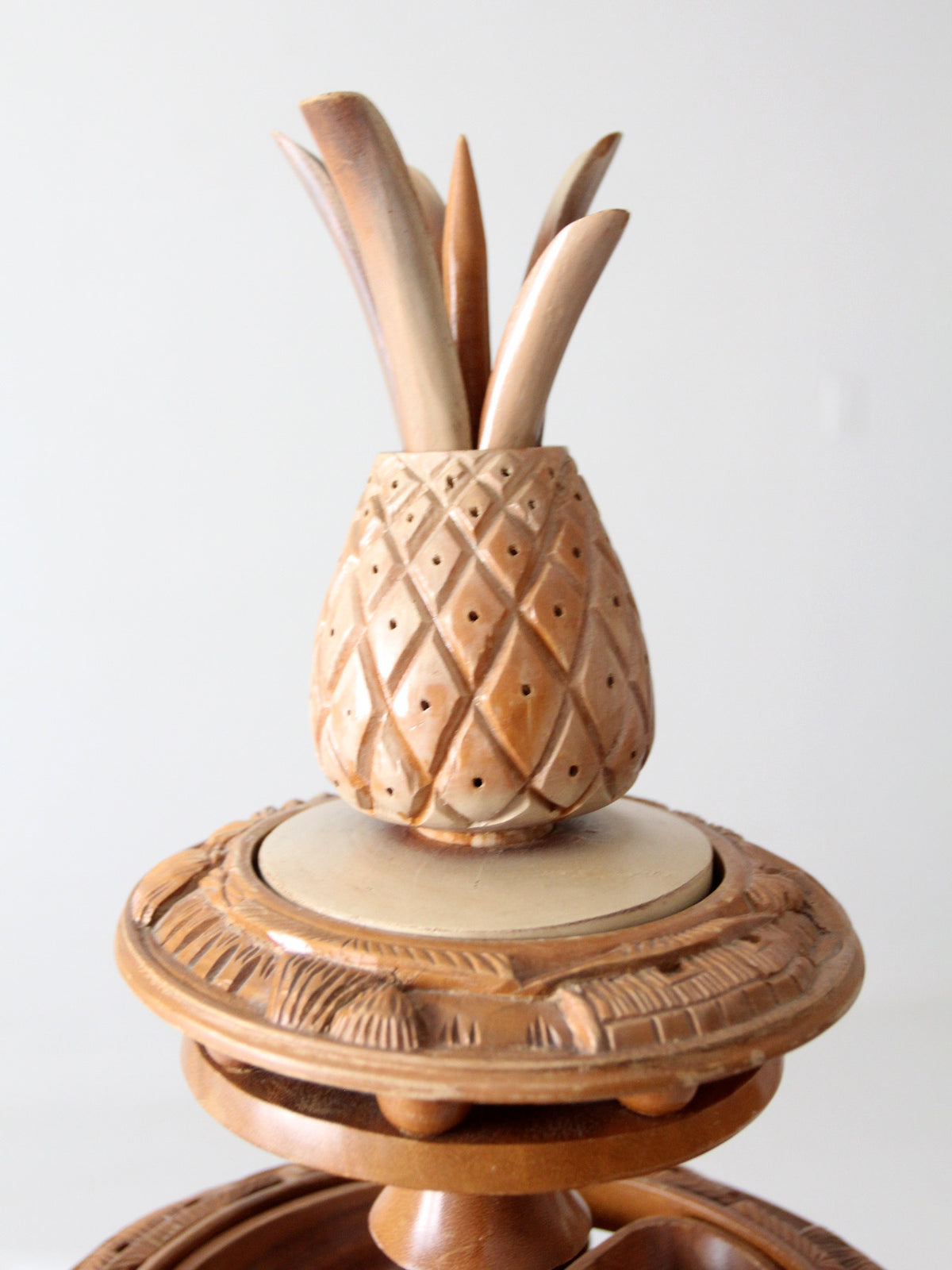mid-century carved wood tiered lazy Susan with pineapple finial