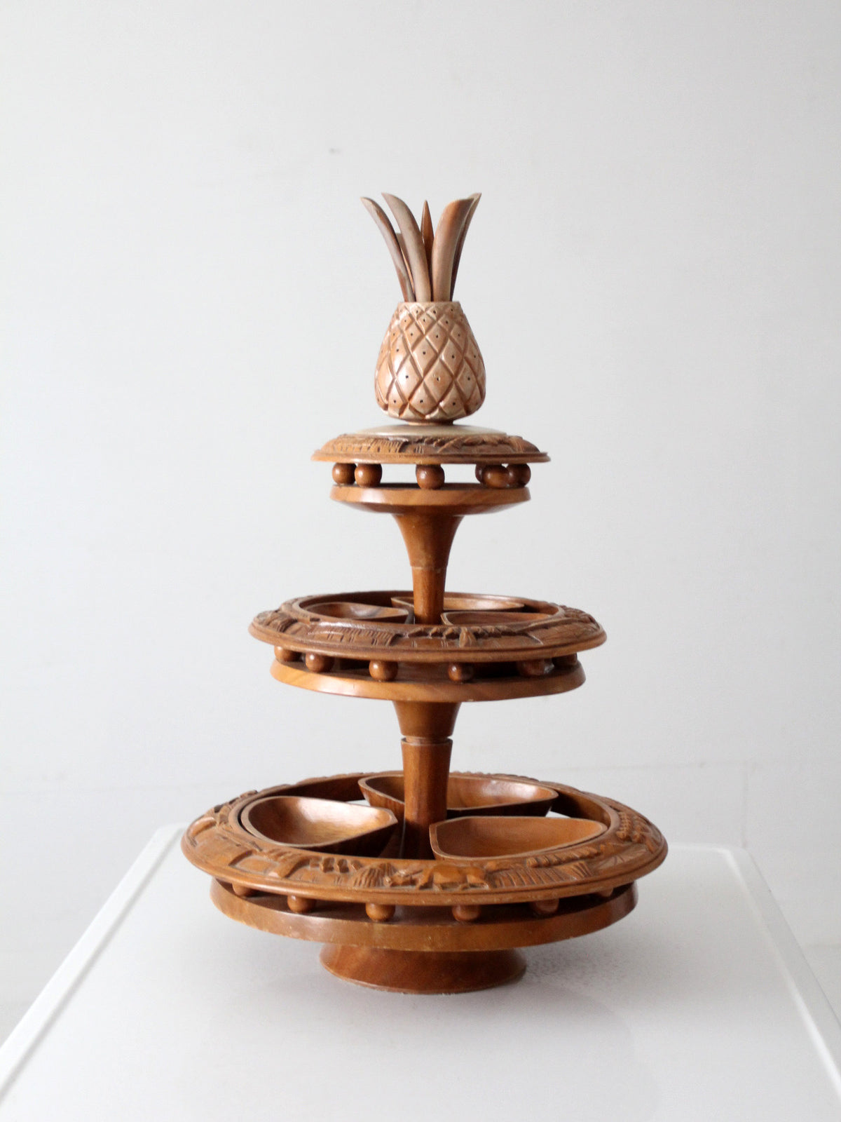 mid-century carved wood tiered lazy Susan with pineapple finial