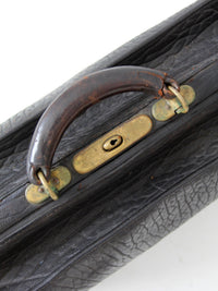 antique 1920s black leather suitcase with brass hardware