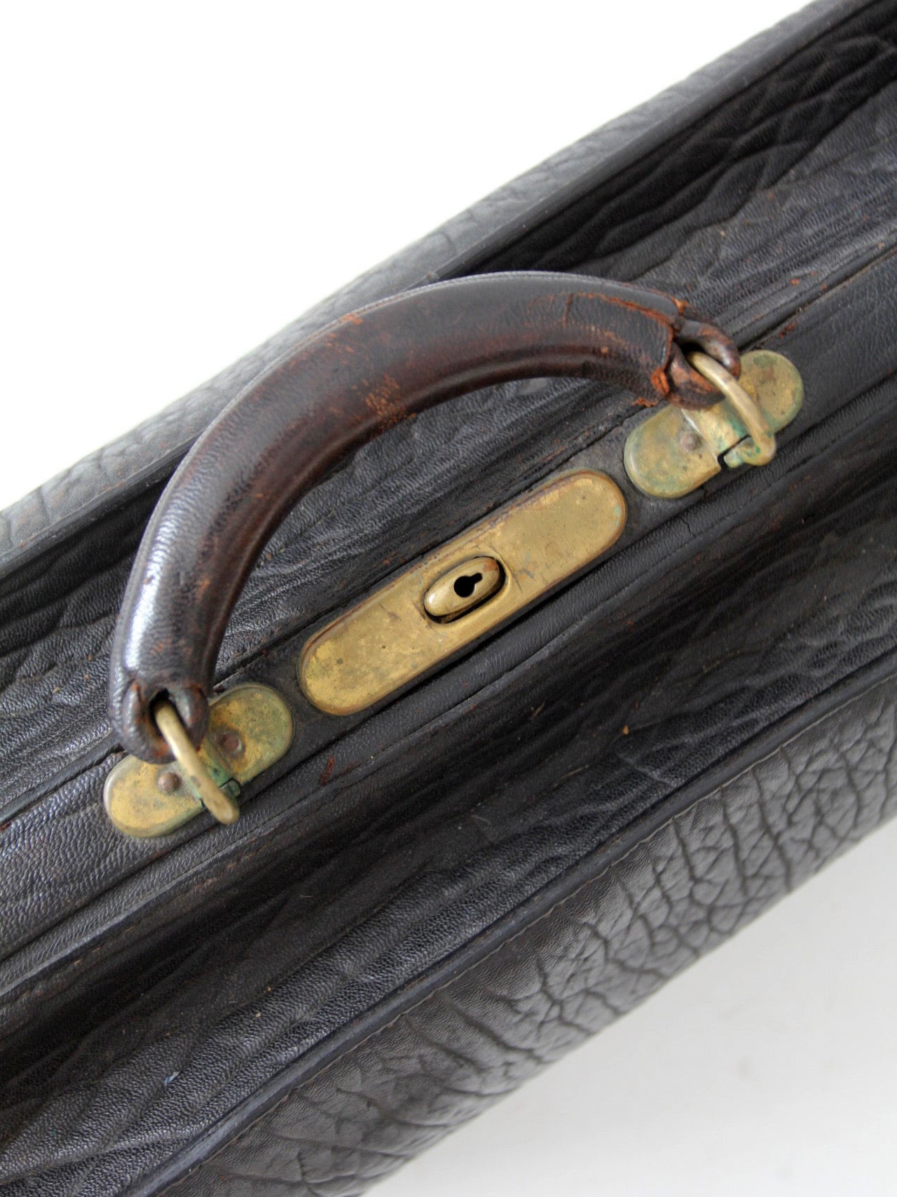antique 1920s black leather suitcase with brass hardware