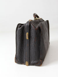 antique 1920s black leather suitcase with brass hardware