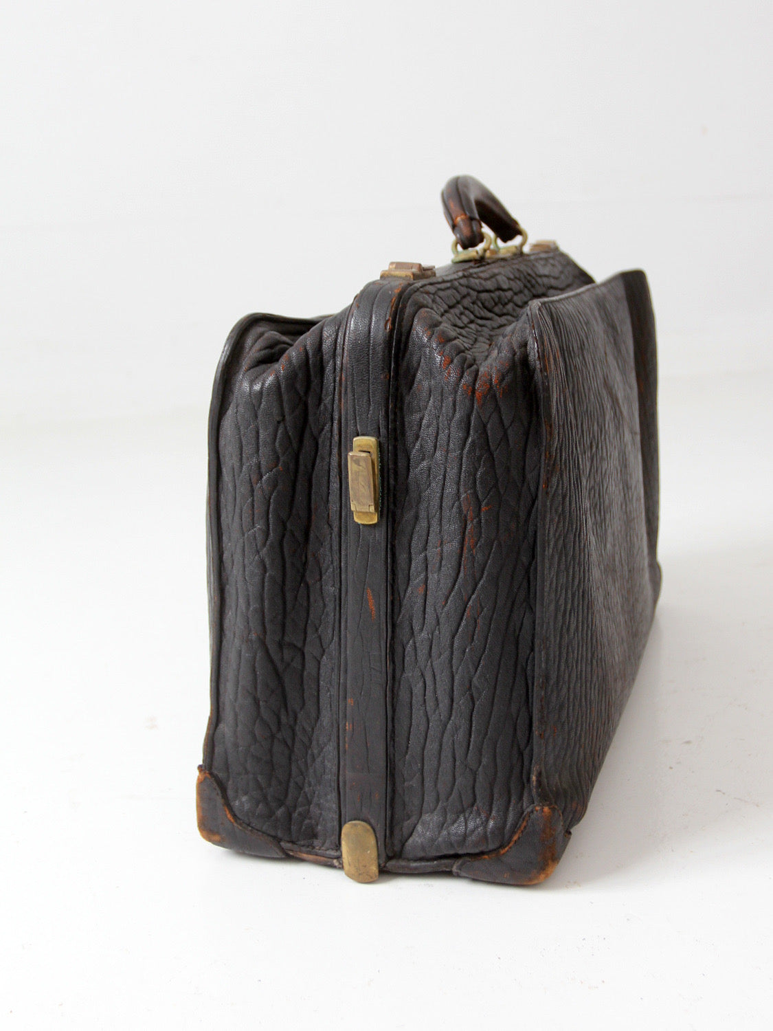 antique 1920s black leather suitcase with brass hardware