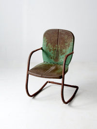 mid-century metal patio chair with cantilever frame