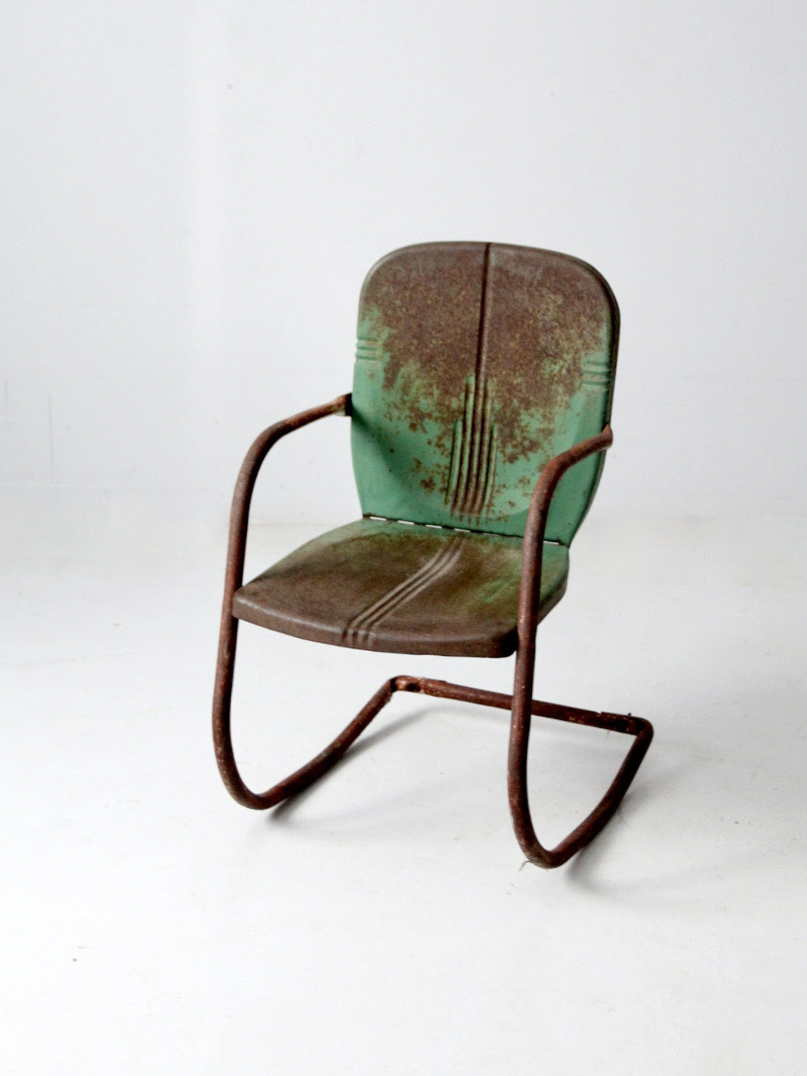 mid-century metal patio chair with cantilever frame