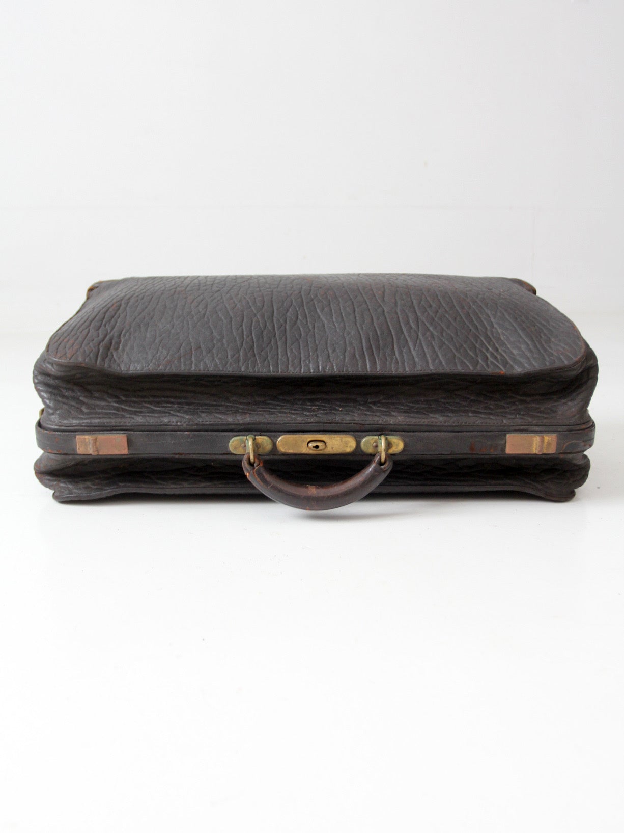 antique 1920s black leather suitcase with brass hardware