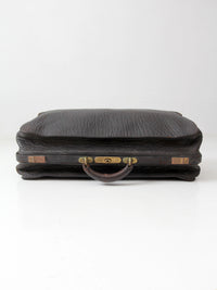 antique 1920s black leather suitcase with brass hardware