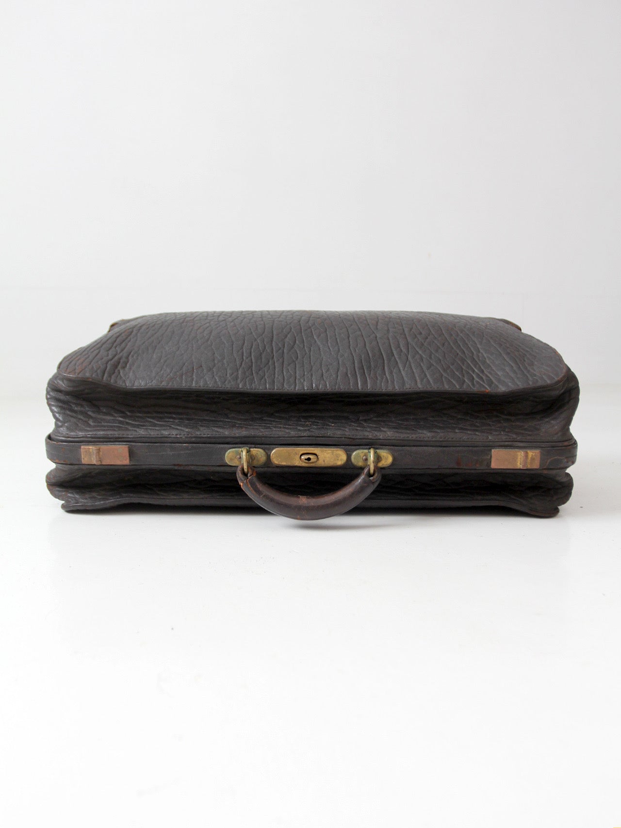 antique 1920s black leather suitcase with brass hardware