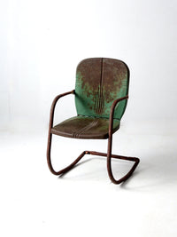 mid-century metal patio chair with cantilever frame