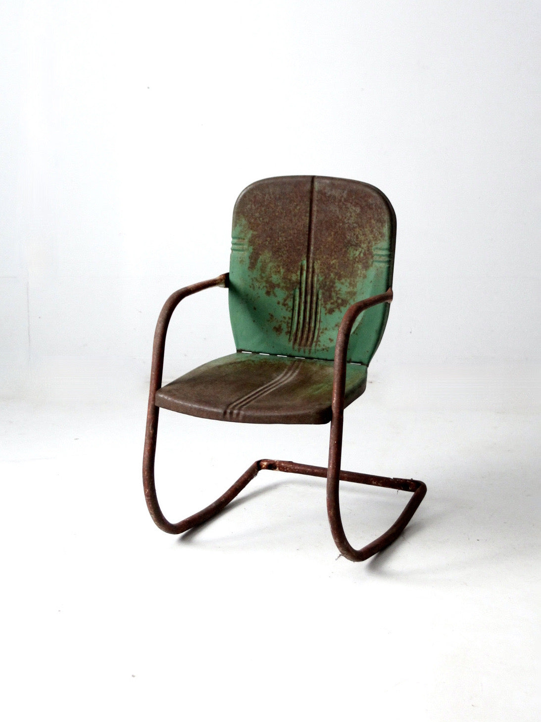 mid-century metal patio chair with cantilever frame