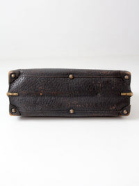 antique 1920s black leather suitcase with brass hardware