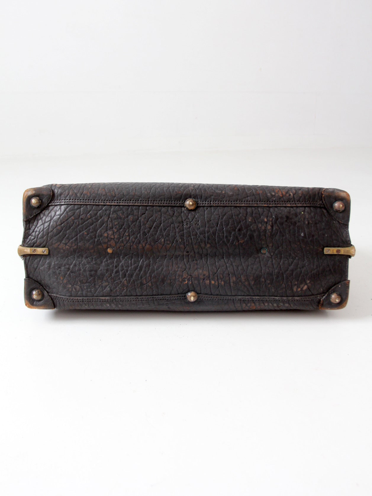 antique 1920s black leather suitcase with brass hardware