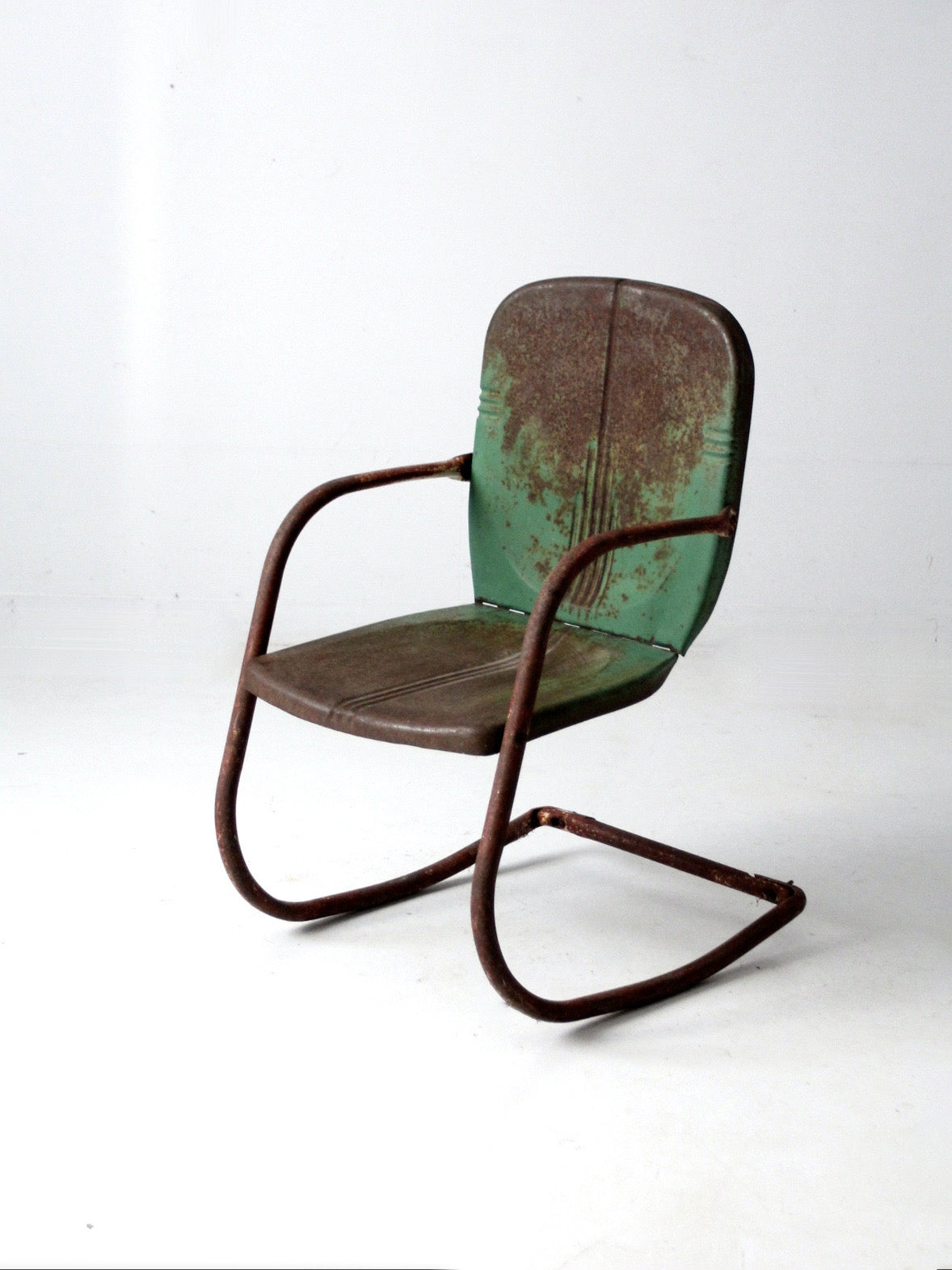 mid-century metal patio chair with cantilever frame