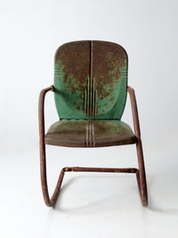 mid-century metal patio chair with cantilever frame