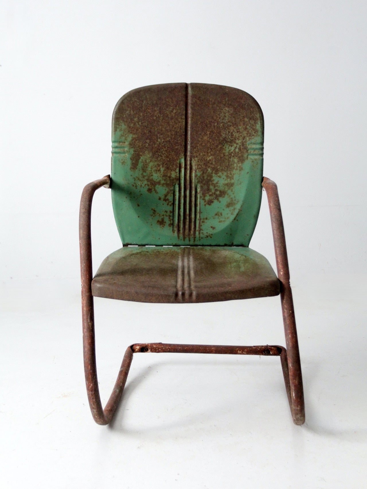 mid-century metal patio chair with cantilever frame