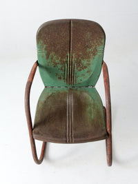 mid-century metal patio chair with cantilever frame