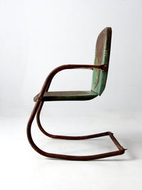 mid-century metal patio chair with cantilever frame