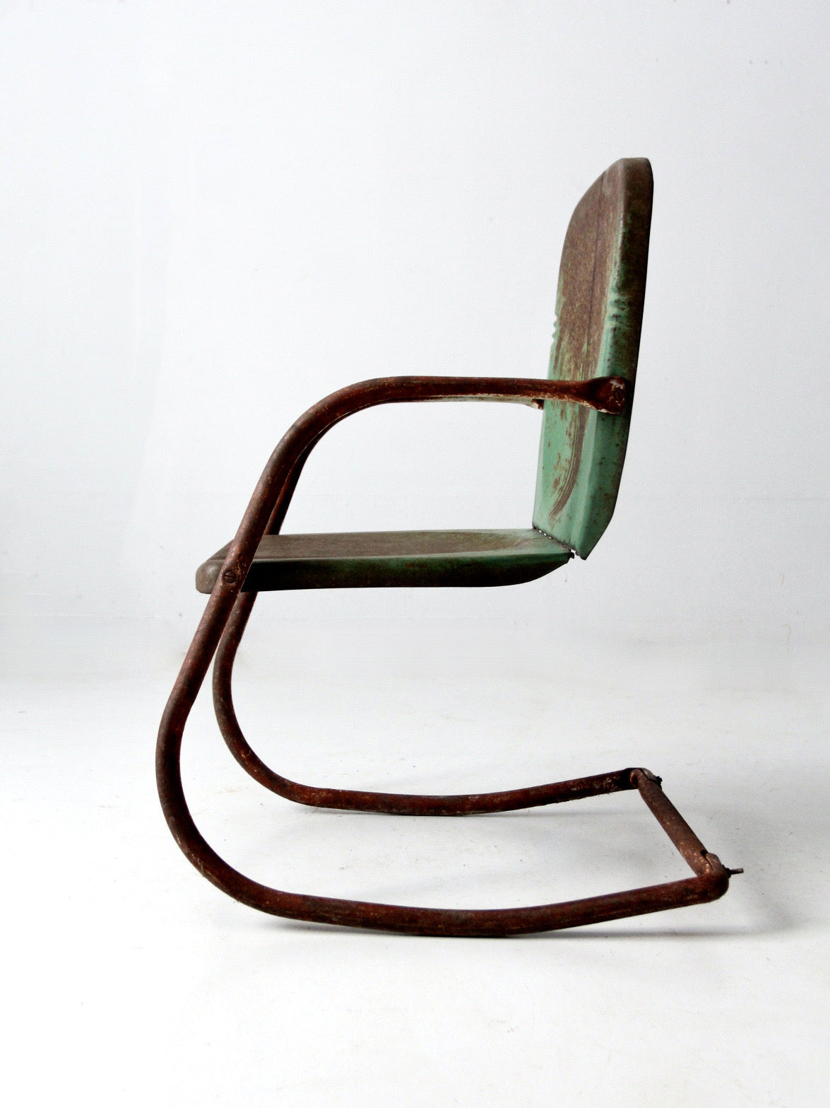 mid-century metal patio chair with cantilever frame