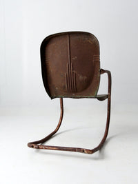 mid-century metal patio chair with cantilever frame