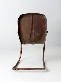 mid-century metal patio chair with cantilever frame
