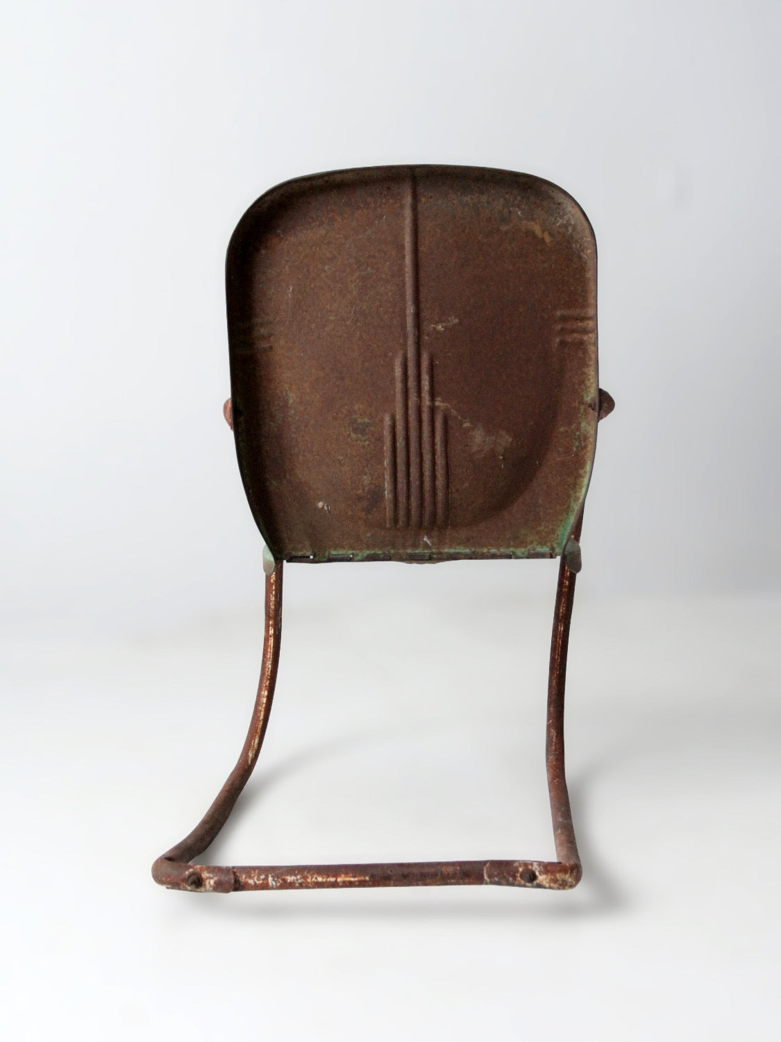 mid-century metal patio chair with cantilever frame