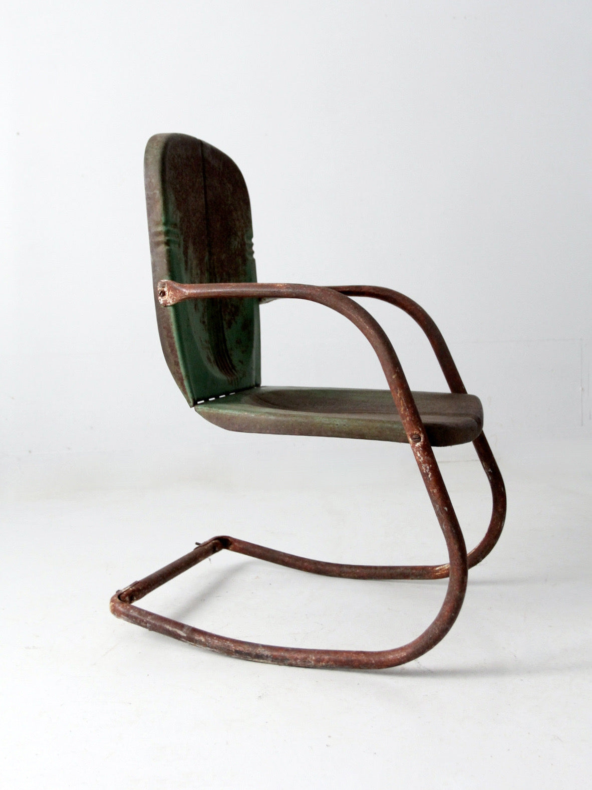 mid-century metal patio chair with cantilever frame