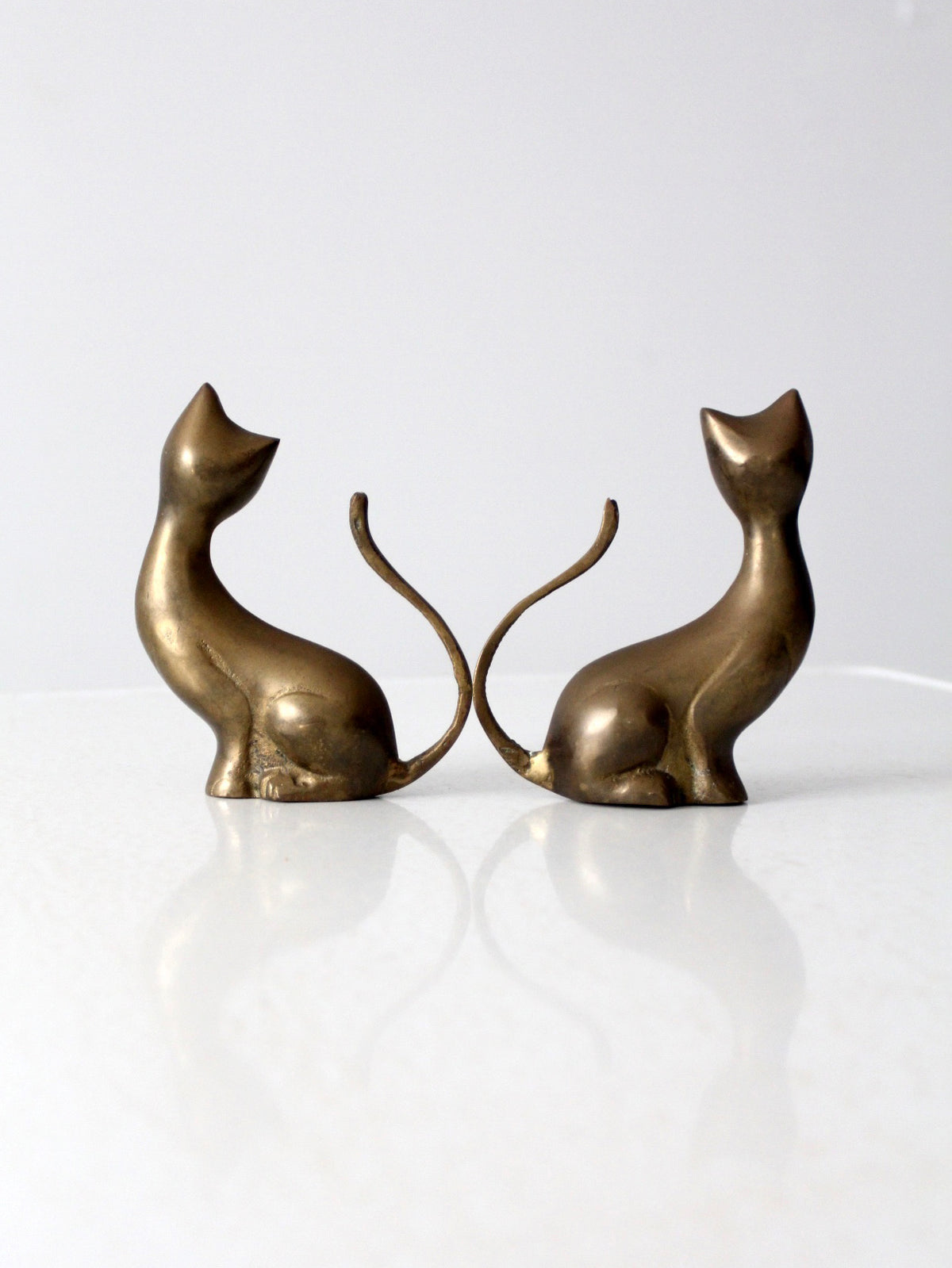 pair of mid-century brass cat figurines