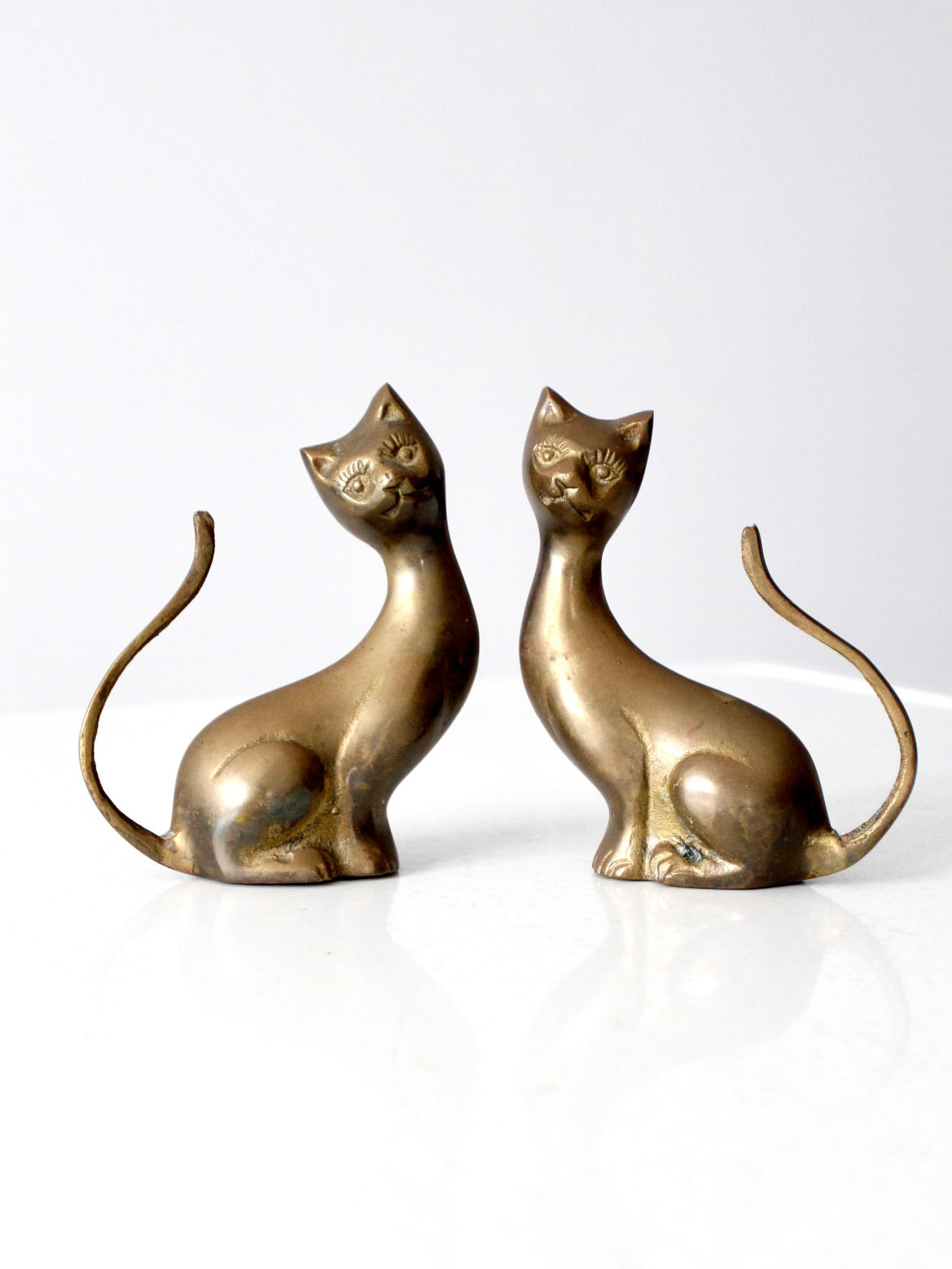 pair of mid-century brass cat figurines