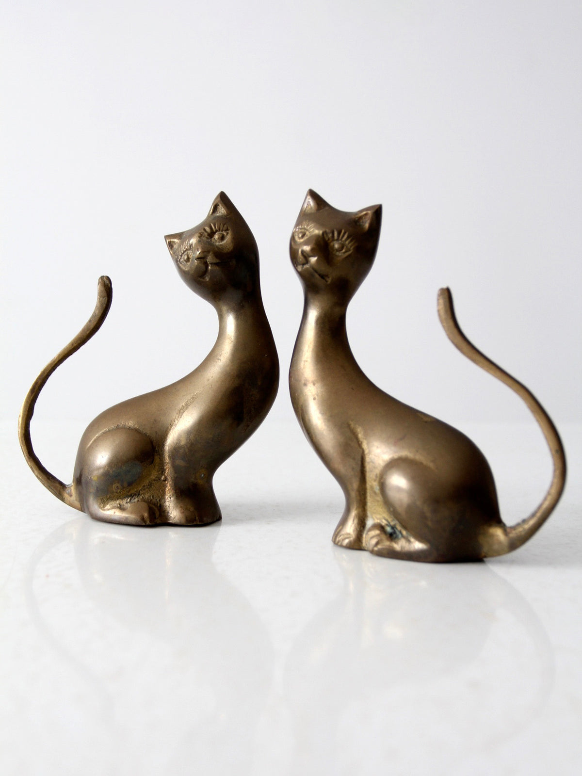 pair of mid-century brass cat figurines