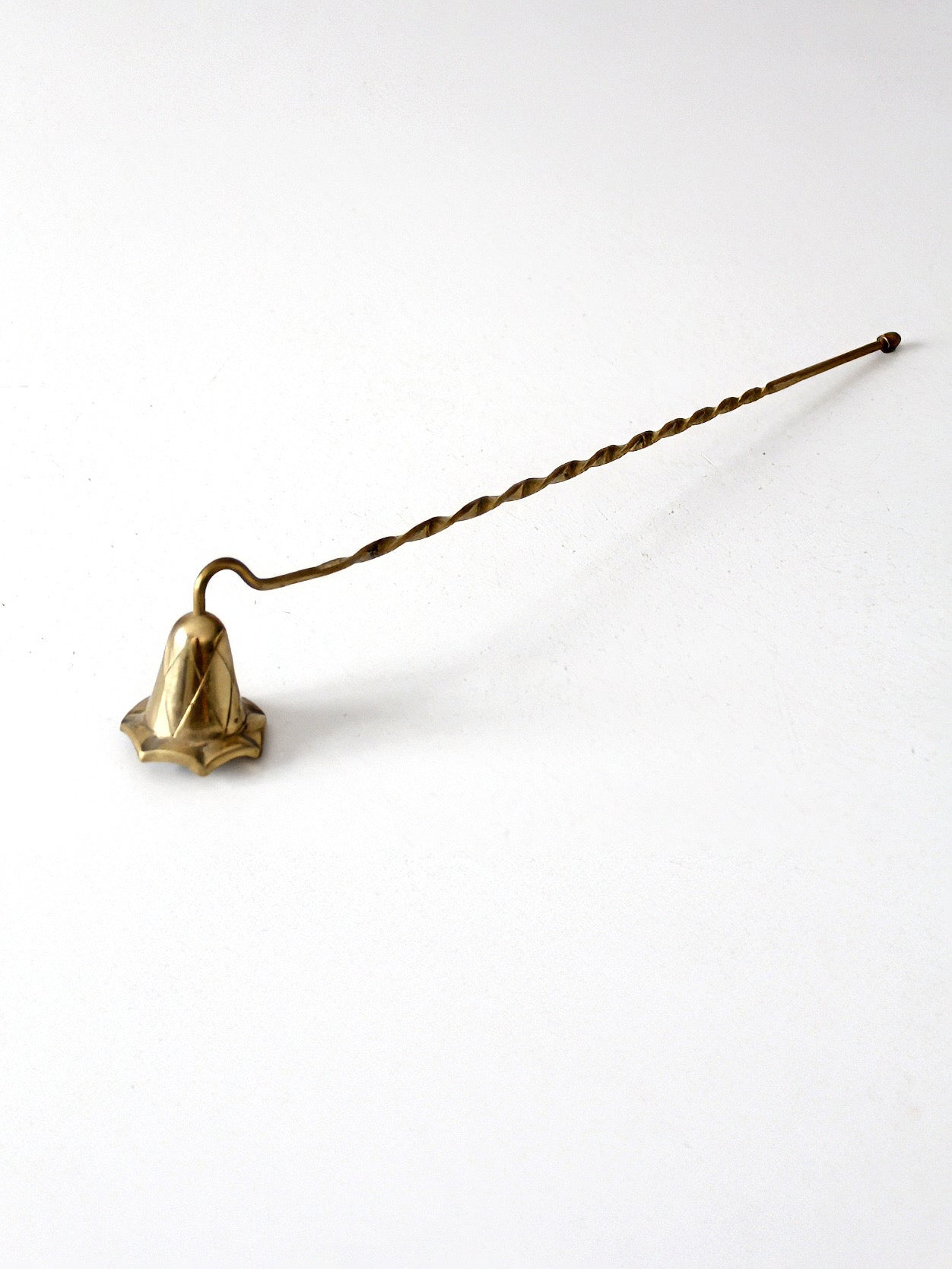 vintage brass candle snuffer with twisted handle