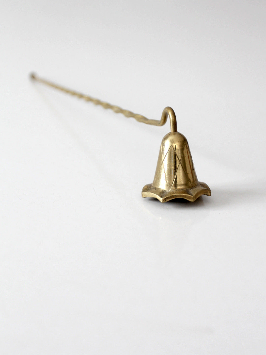 vintage brass candle snuffer with twisted handle