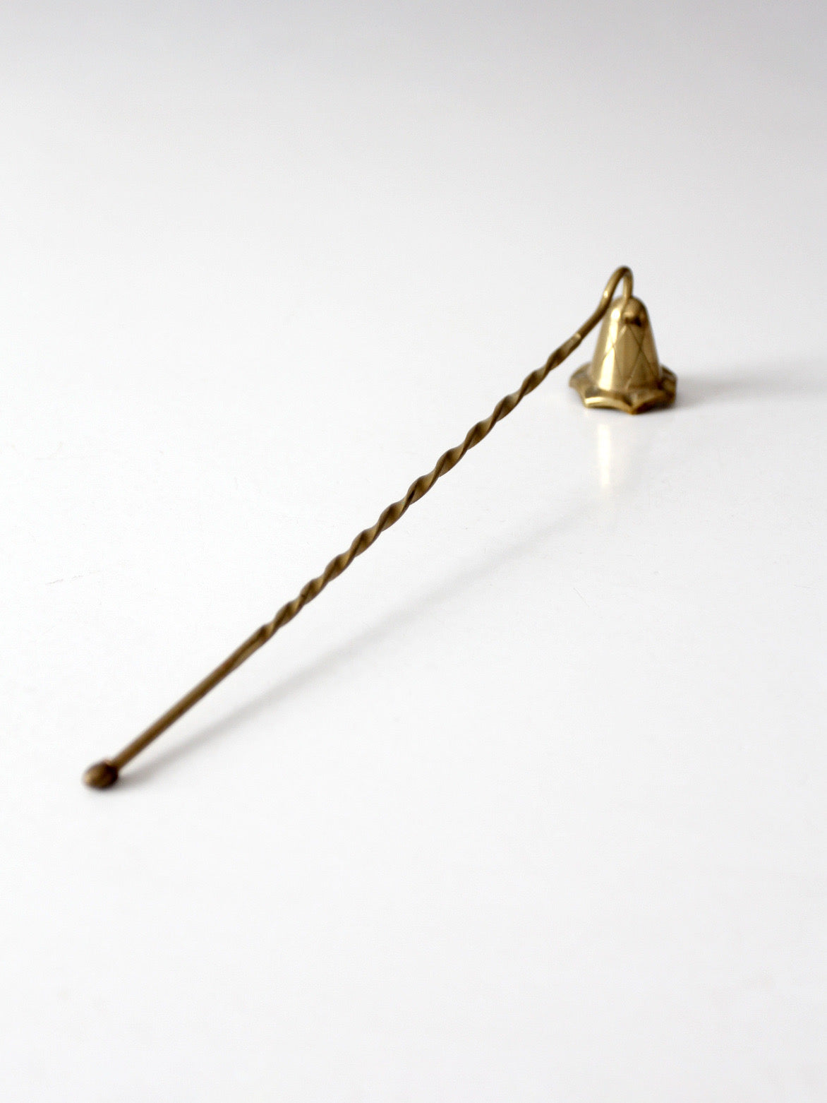 vintage brass candle snuffer with twisted handle
