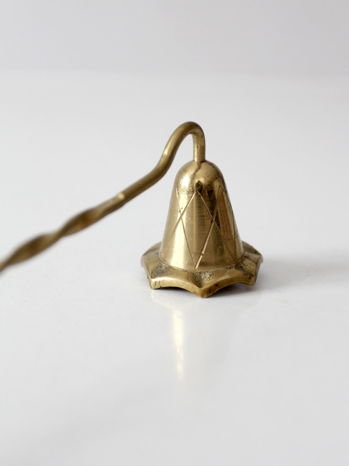 vintage brass candle snuffer with twisted handle