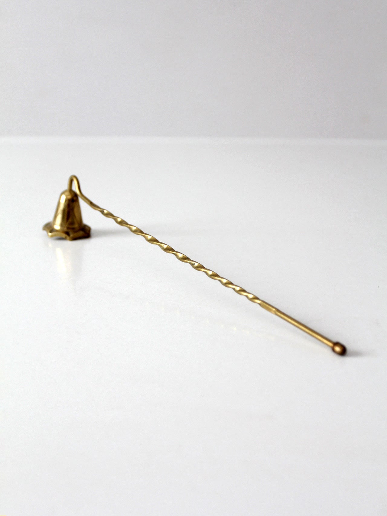 vintage brass candle snuffer with twisted handle