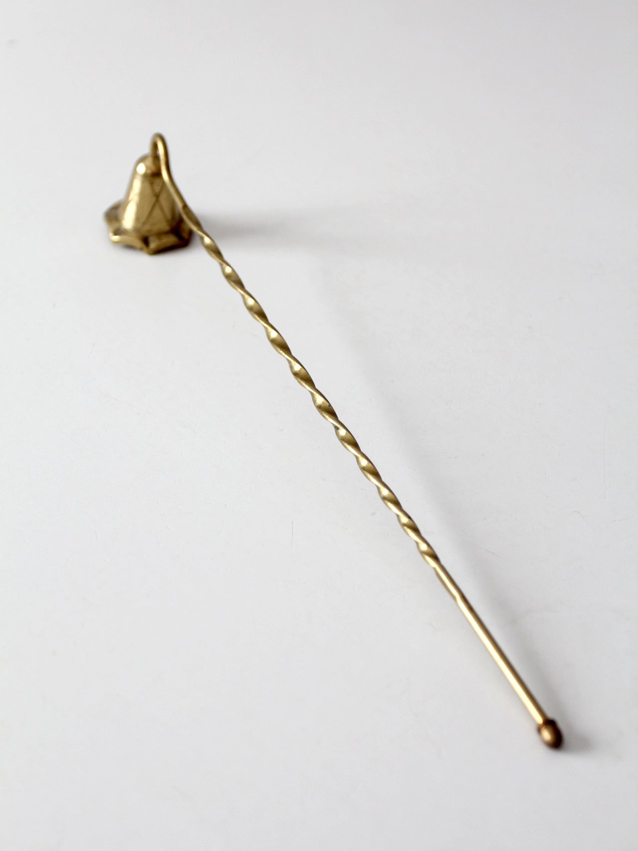 vintage brass candle snuffer with twisted handle