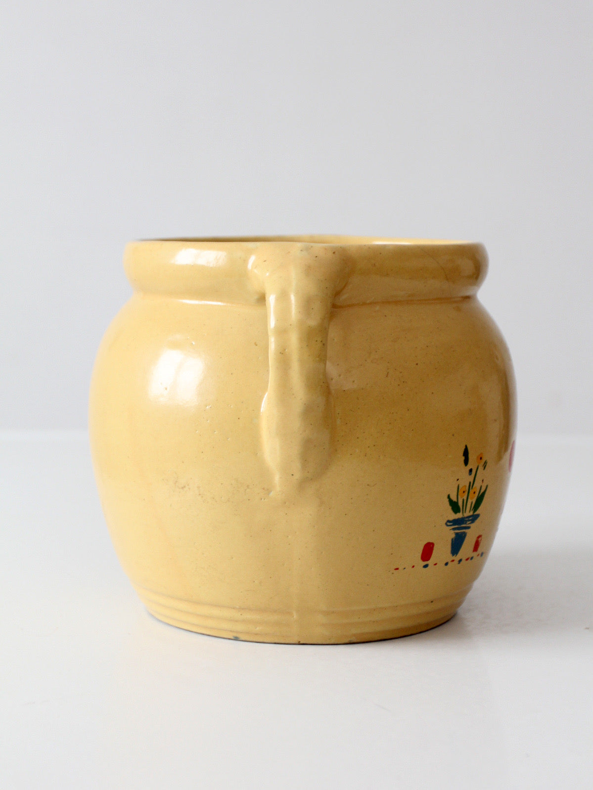 vintage yellow ceramic cookie jar vase with floral design