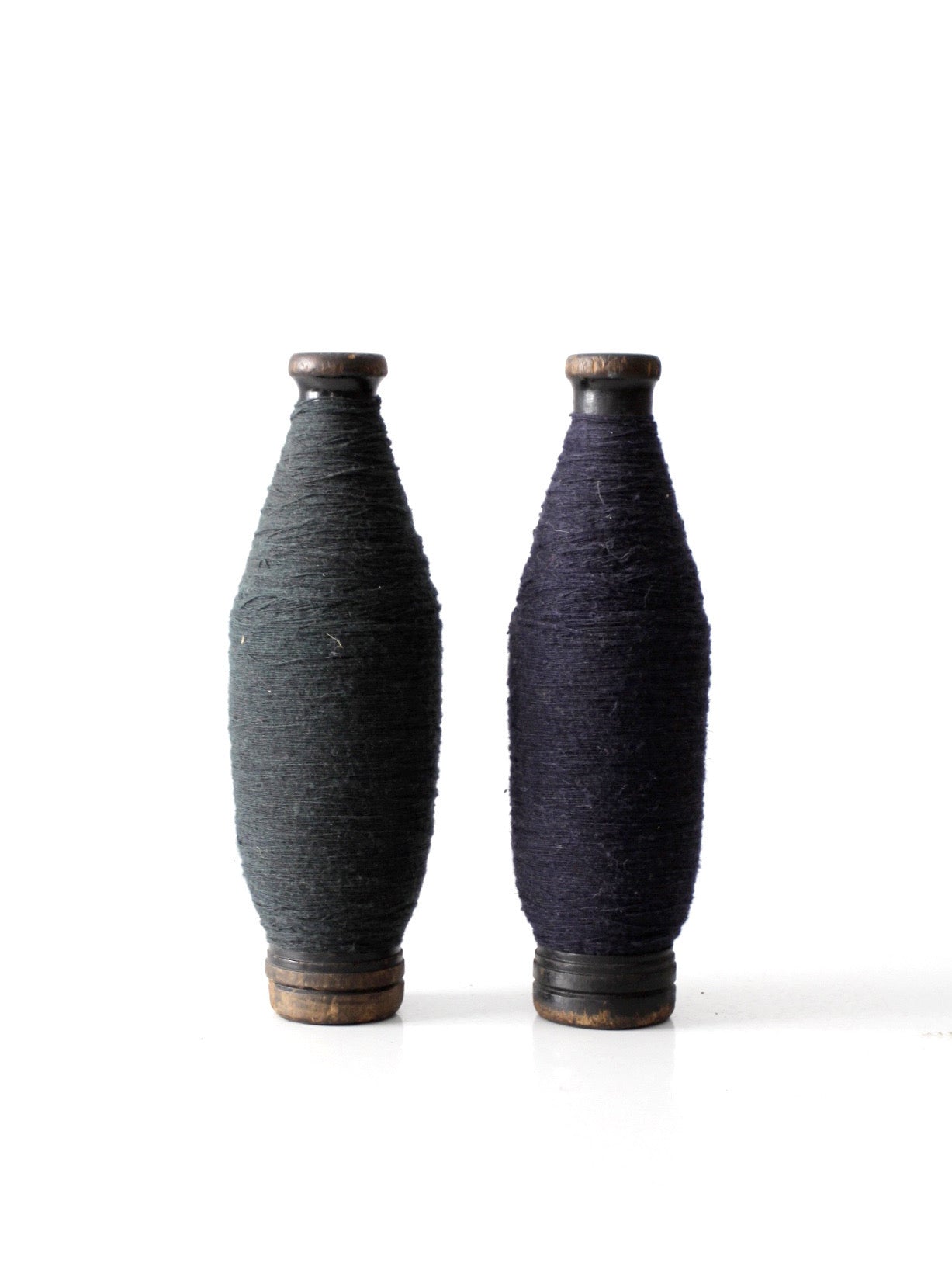 pair of antique wooden thread spools