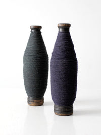 pair of antique wooden thread spools