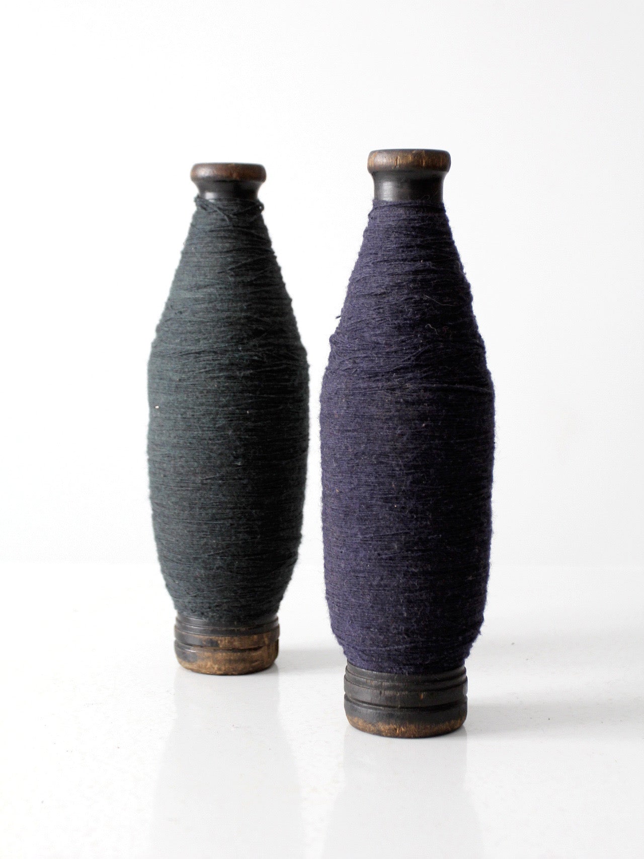 pair of antique wooden thread spools