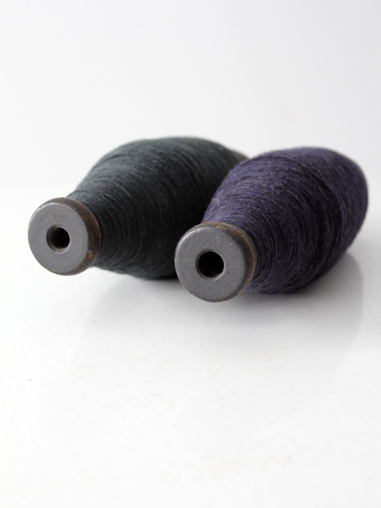 pair of antique wooden thread spools