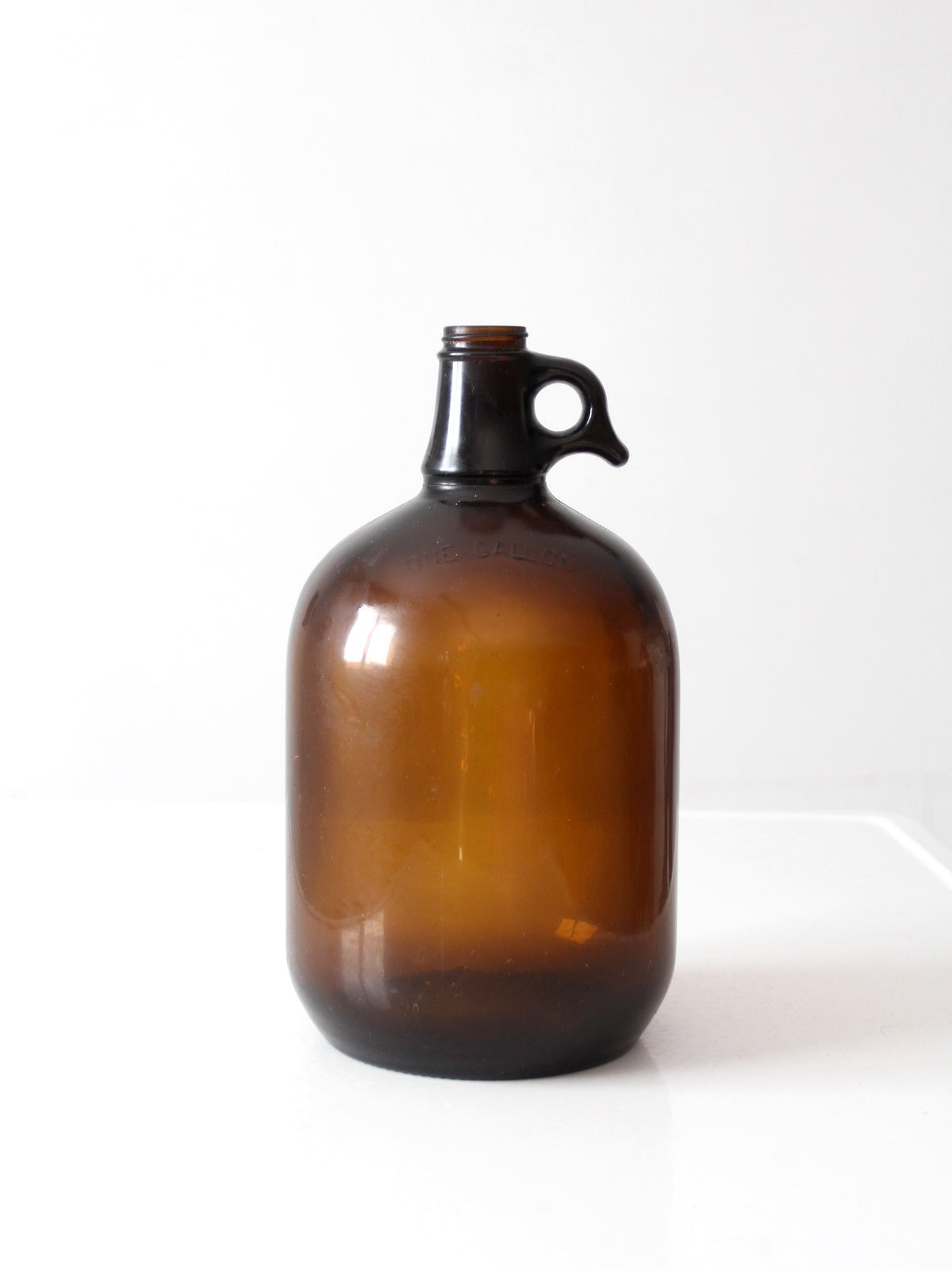 mid-century one-gallon amber glass jug