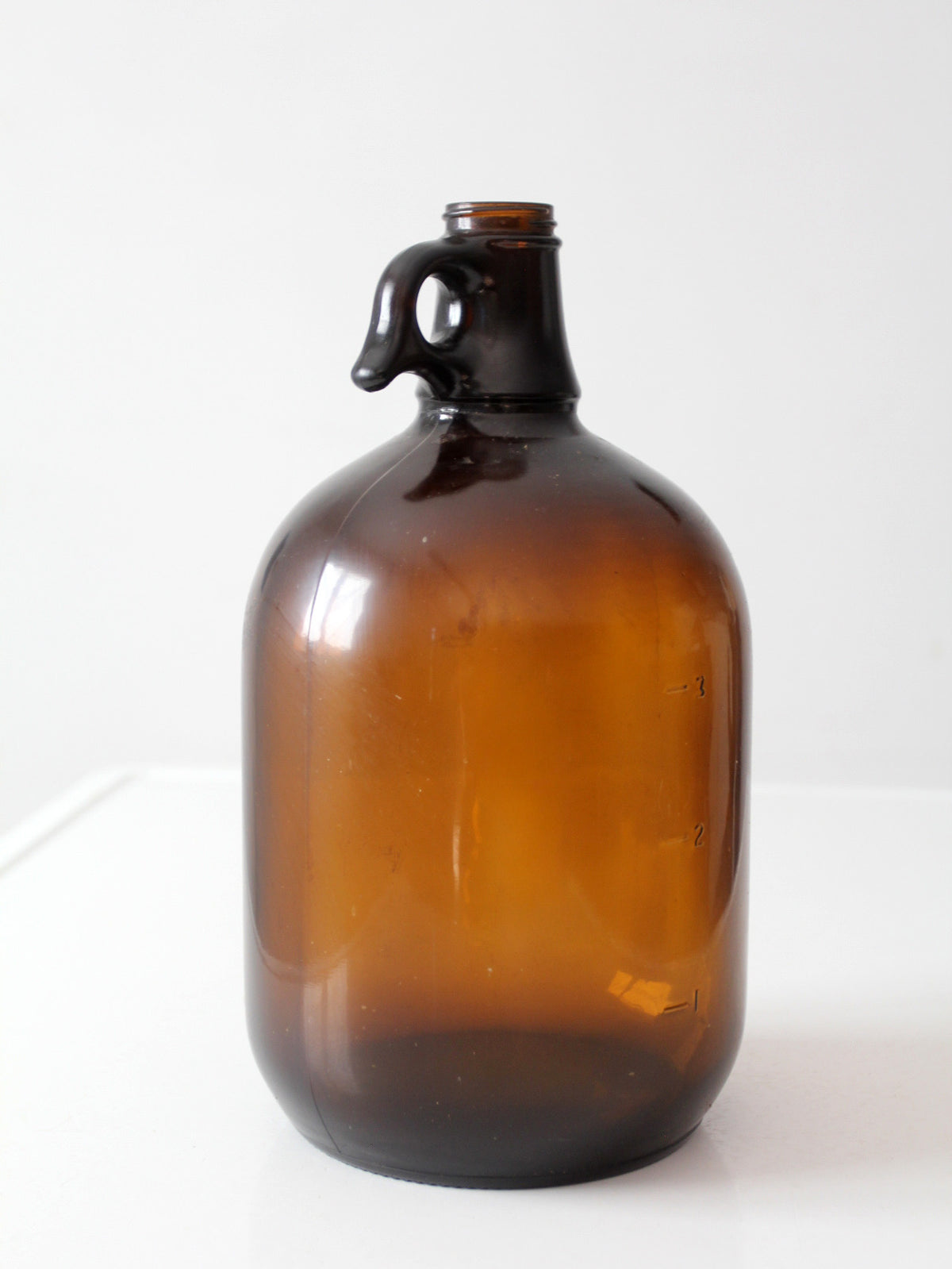 mid-century one-gallon amber glass jug
