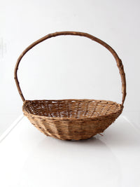 antique willow gathering basket with branch handle