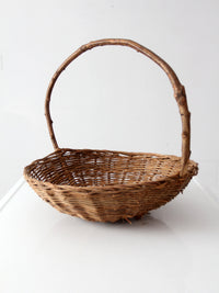 antique willow gathering basket with branch handle