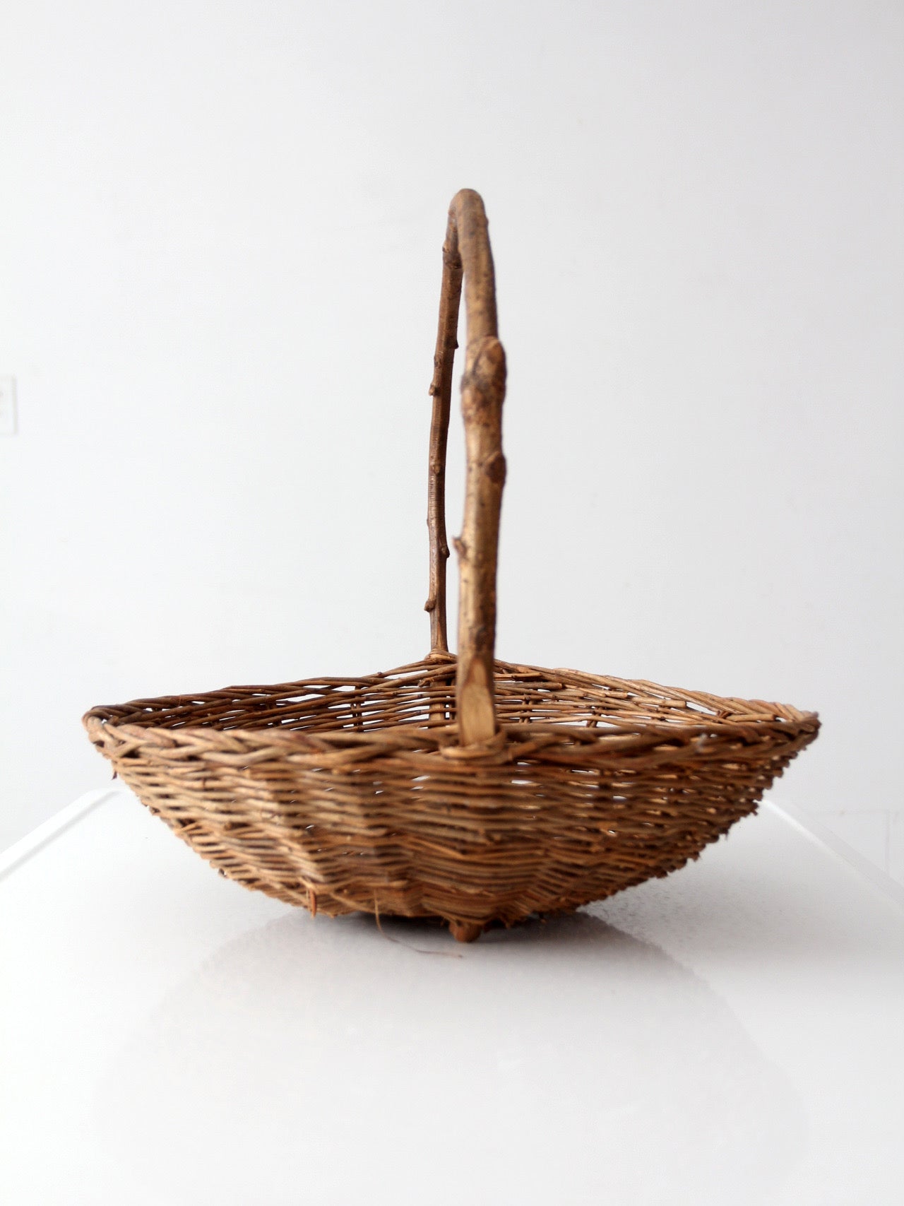 antique willow gathering basket with branch handle