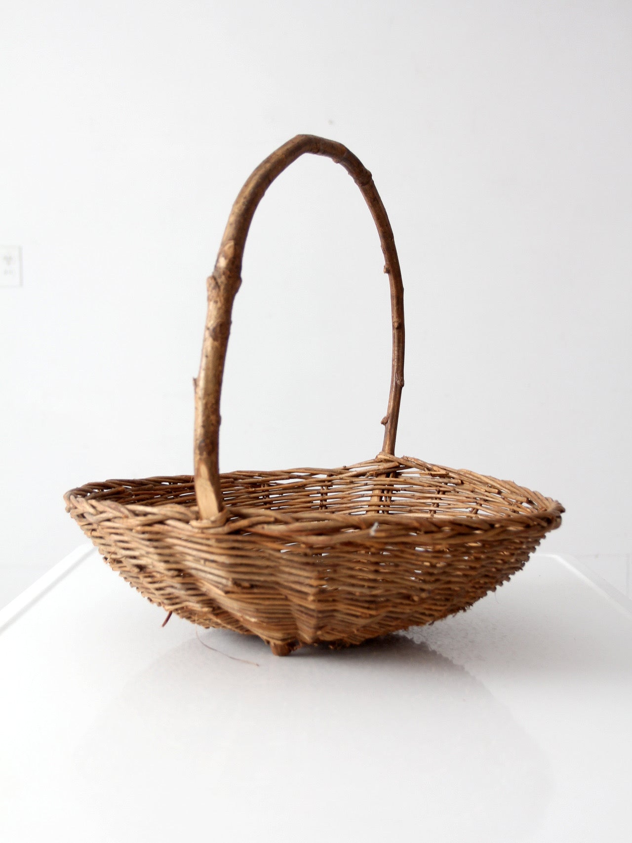 antique willow gathering basket with branch handle